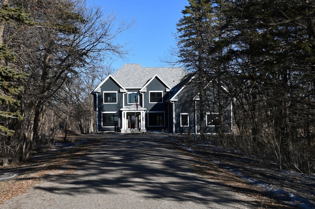 traditional-style home featuring driveway