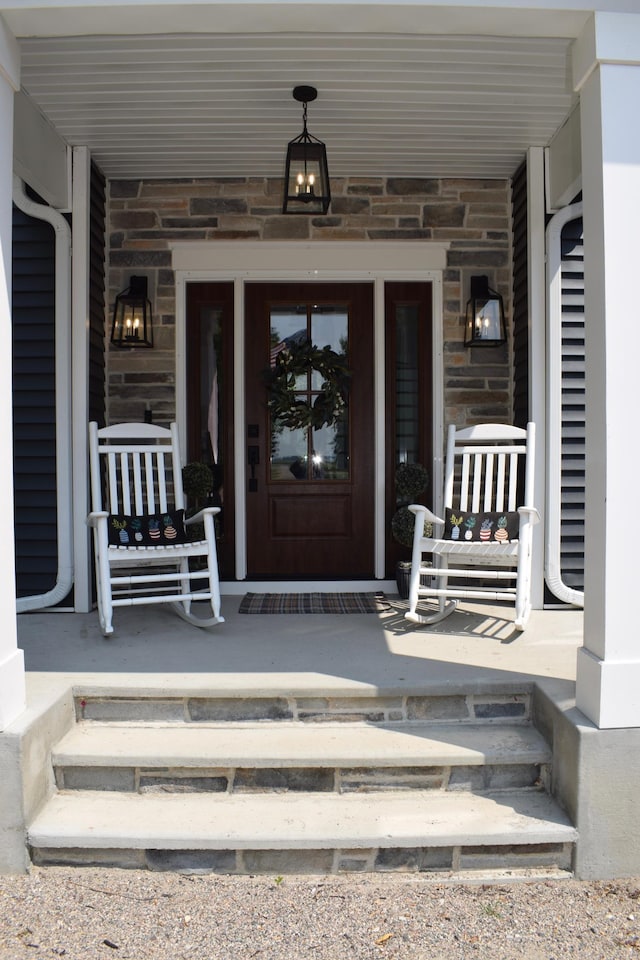 12424 126th Ave NE, Thief River Falls, MN 56701 - view of exterior entry featuring a porch and stone siding