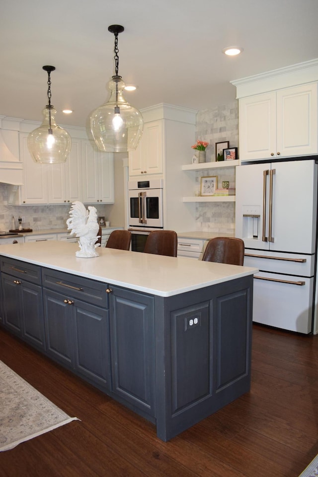 12424 126th Ave NE, Thief River Falls, MN 56701 - kitchen with white appliances, white cabinetry, a center island, dark wood-type flooring, and recessed lighting