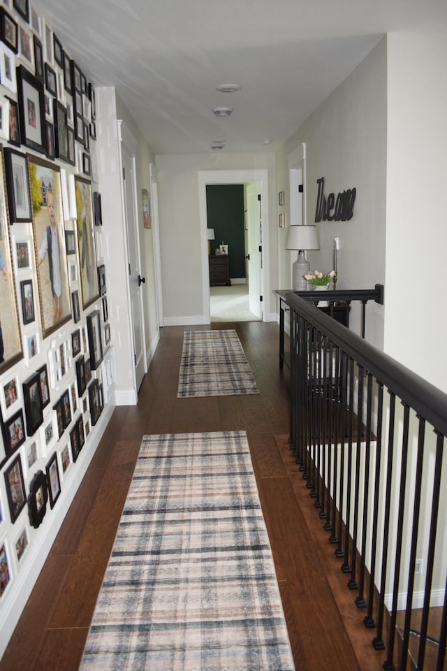 12424 126th Ave NE, Thief River Falls, MN 56701 - hall with wood finished floors, an upstairs landing, and baseboards