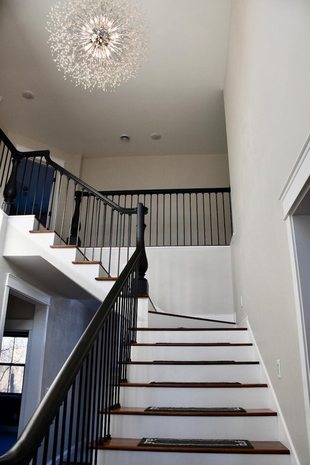 12424 126th Ave NE, Thief River Falls, MN 56701 - stairs featuring a chandelier and baseboards