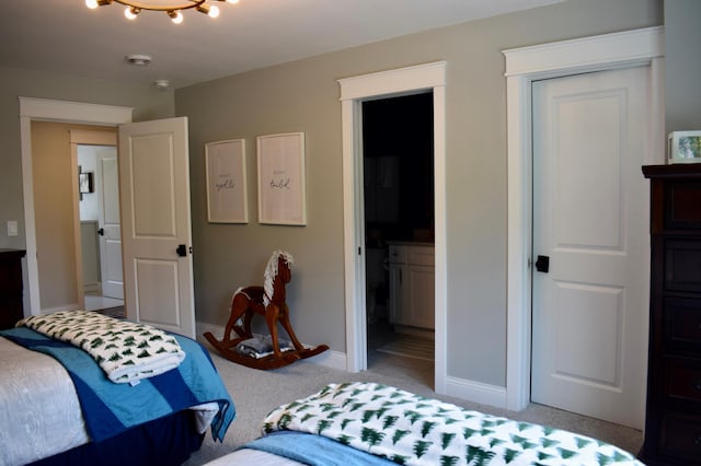 12424 126th Ave NE, Thief River Falls, MN 56701 - bedroom featuring light colored carpet, baseboards, and ensuite bathroom