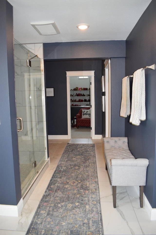 12424 126th Ave NE, Thief River Falls, MN 56701 - ensuite bathroom featuring baseboards, a shower stall, marble look tile flooring, and recessed lighting