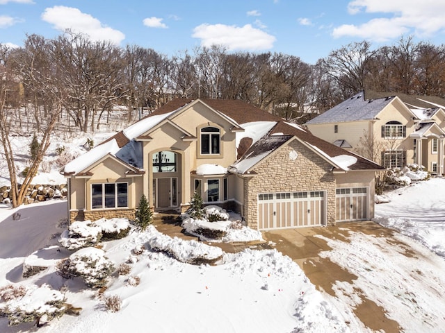 view of front of home featuring a garage and stone siding