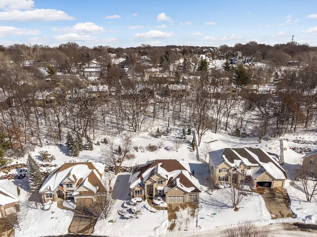 snowy aerial view with a residential view