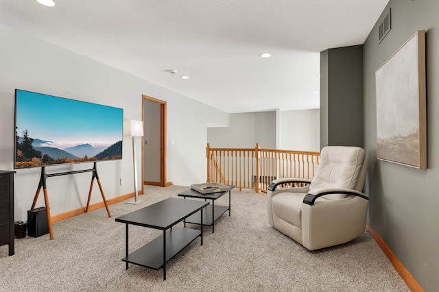 carpeted living room with recessed lighting, visible vents, and baseboards