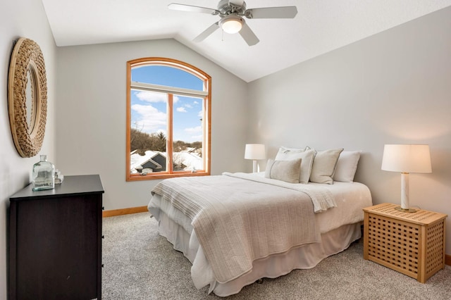 bedroom with lofted ceiling, light colored carpet, ceiling fan, and baseboards