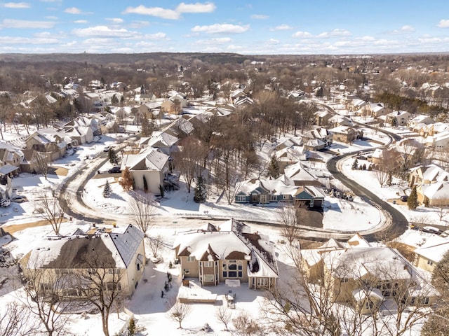 snowy aerial view featuring a residential view