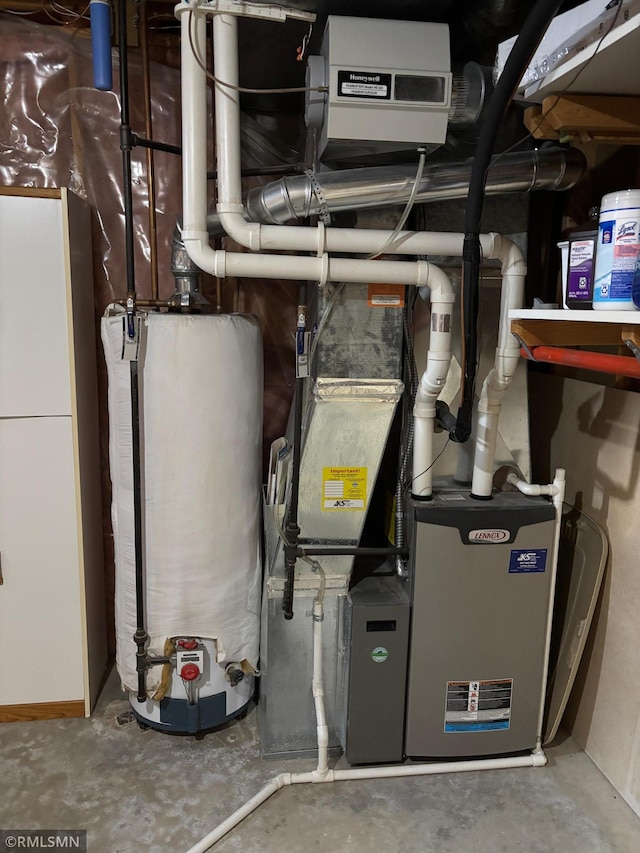 utility room featuring gas water heater