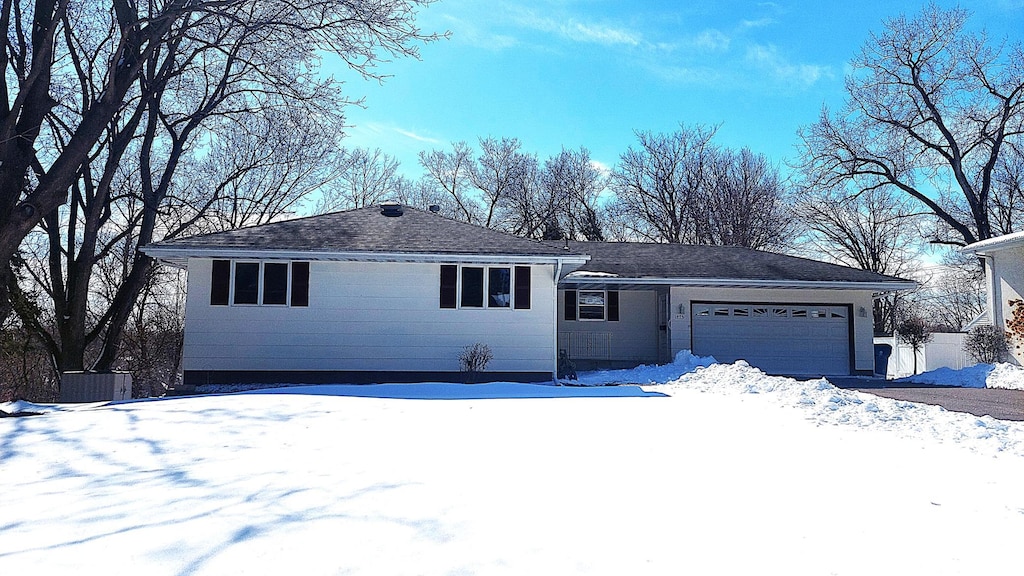 single story home featuring a garage