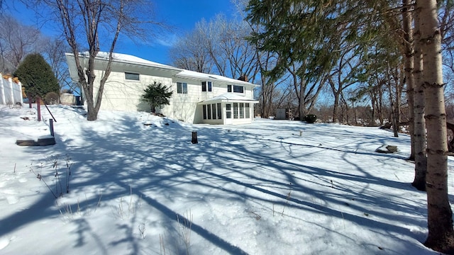 view of front of home with a sunroom