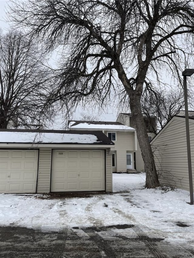 view of snow covered garage