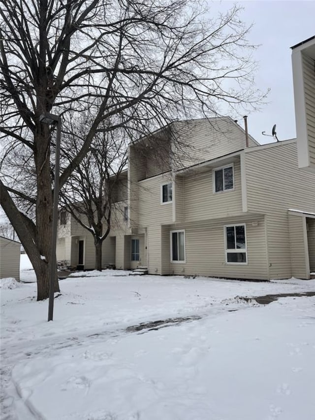 view of snow covered property