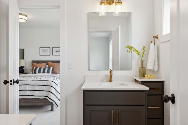 bathroom featuring ensuite bathroom and vanity