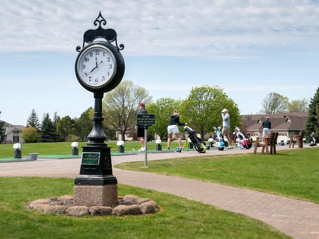 view of home's community featuring a lawn