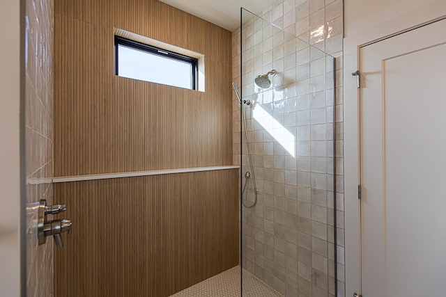 full bath with a tile shower