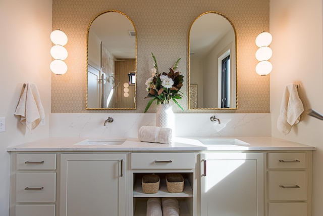 full bath featuring visible vents, vanity, and wallpapered walls