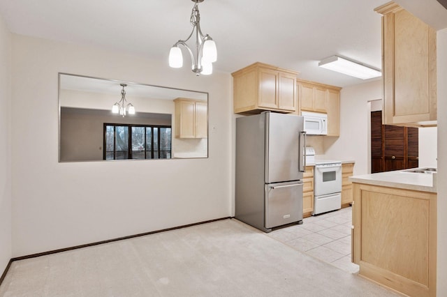 kitchen with light carpet, white appliances, decorative light fixtures, light brown cabinetry, and a notable chandelier