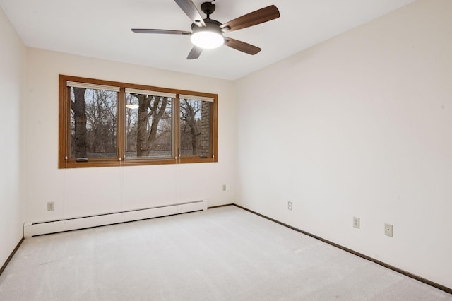 empty room with baseboards, baseboard heating, a ceiling fan, and light colored carpet