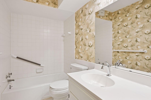 bathroom with tub / shower combination, vanity, toilet, and wallpapered walls