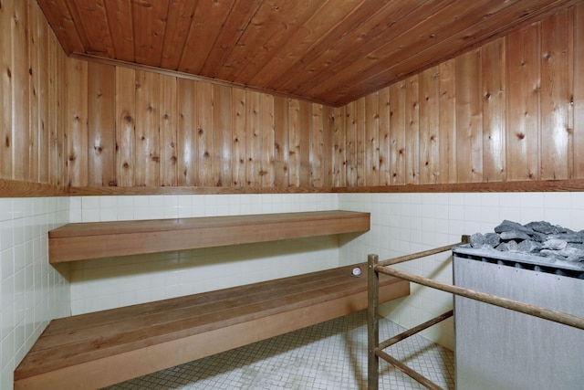 view of sauna featuring a wainscoted wall and tile patterned flooring