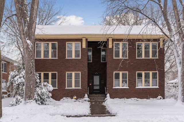 view of front of house featuring brick siding