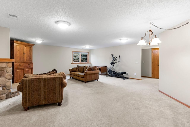 living area with light carpet, baseboards, visible vents, a textured ceiling, and a fireplace