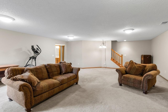 living area featuring stairs, a textured ceiling, light carpet, and visible vents