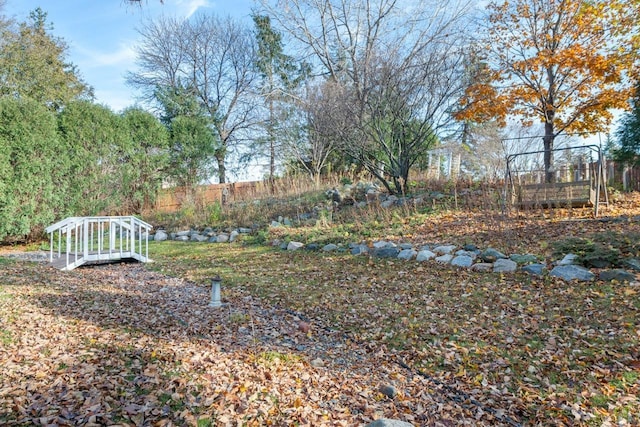 view of yard with a garden and fence