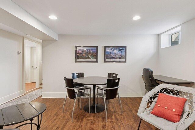 dining room featuring recessed lighting, wood finished floors, and baseboards