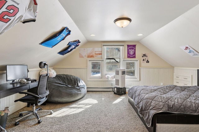 carpeted bedroom with a baseboard radiator, a wainscoted wall, and vaulted ceiling