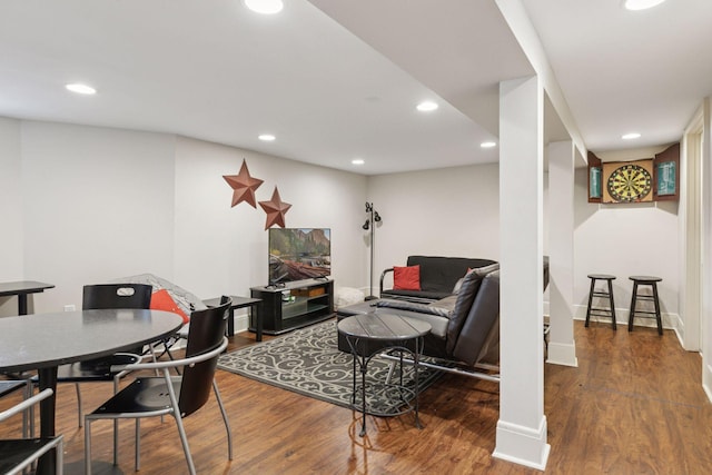 living area with recessed lighting, baseboards, and wood finished floors