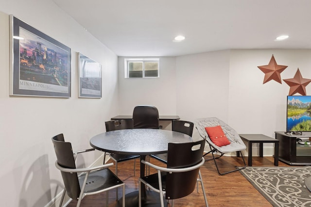 dining space featuring recessed lighting, baseboards, and wood finished floors