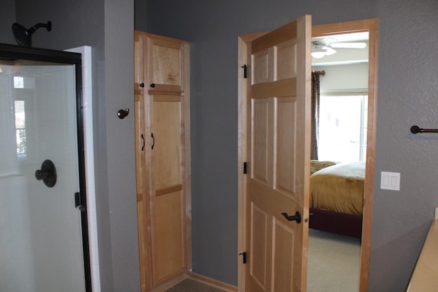 full bath featuring a shower stall and ensuite bathroom