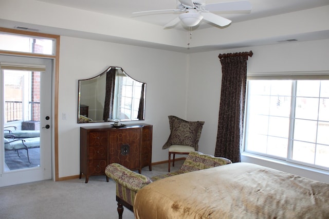 bedroom featuring visible vents, multiple windows, carpet, and access to outside