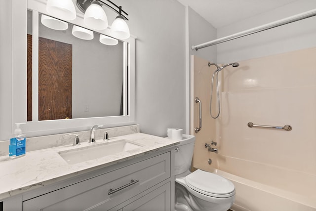 full bath featuring toilet, vanity, and bathtub / shower combination