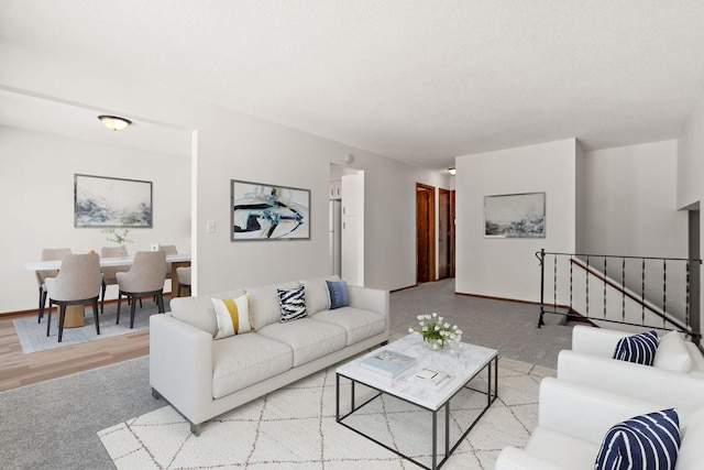 living area featuring baseboards