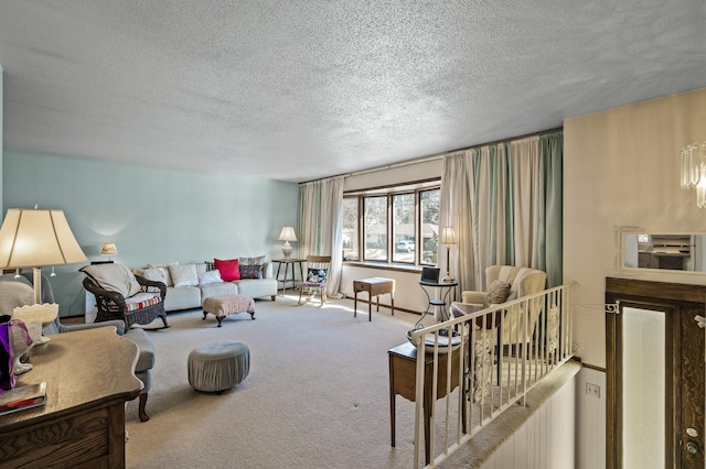 carpeted living area with a textured ceiling