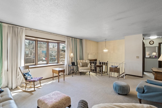 living room with carpet floors, a textured ceiling, and baseboards