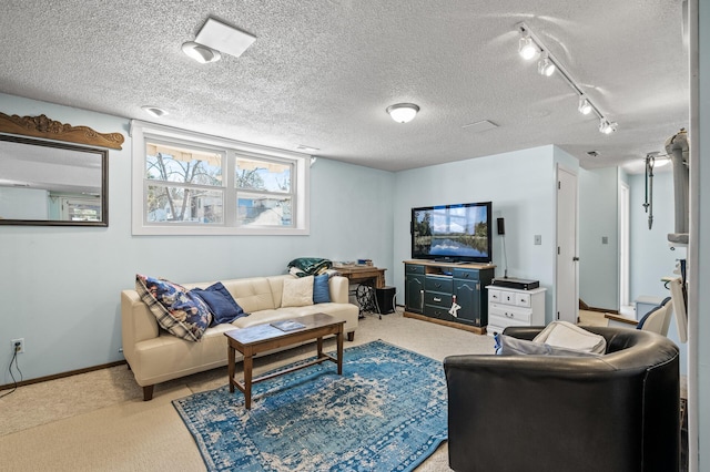 carpeted living area featuring a textured ceiling and baseboards