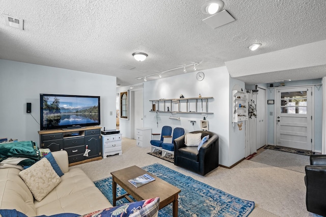 living area featuring a textured ceiling, carpet floors, and visible vents