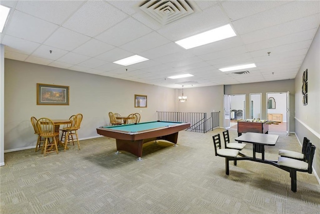 recreation room with baseboards, visible vents, a drop ceiling, and light colored carpet