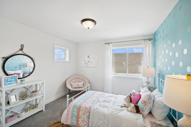 carpeted bedroom with baseboards