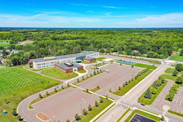 birds eye view of property with a forest view