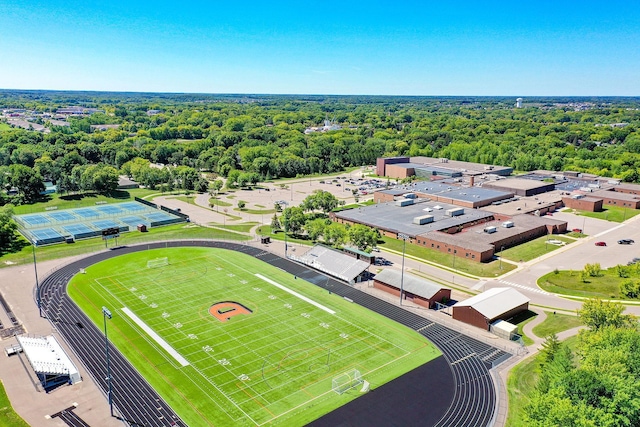drone / aerial view with a wooded view