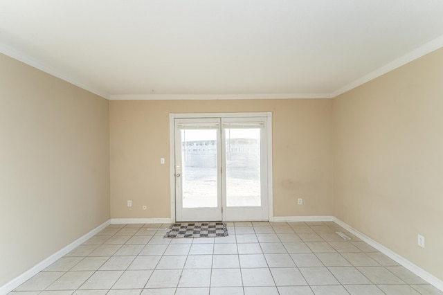 empty room with light tile patterned flooring, baseboards, and ornamental molding