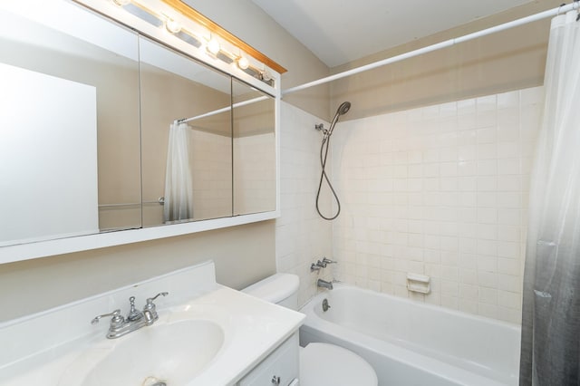 full bathroom featuring toilet, vanity, and shower / bathtub combination with curtain