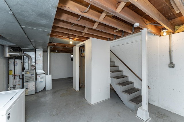 unfinished below grade area featuring stairs, gas water heater, fridge, and heating unit