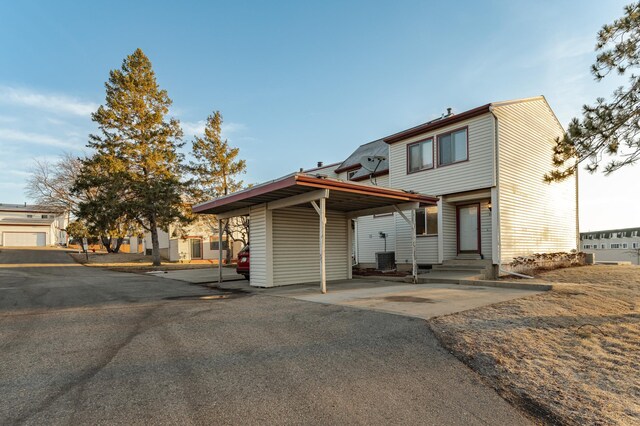 view of front of home featuring a carport and entry steps