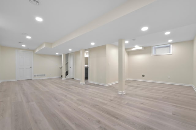 basement featuring light wood finished floors, recessed lighting, and baseboards